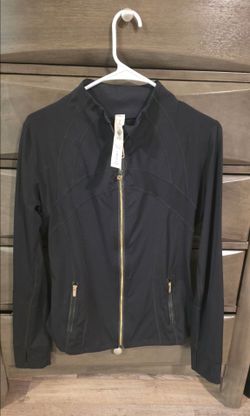 Black Lululemon Define Jacket with gold zipper
Nylon, lycra & spandex
Size 8