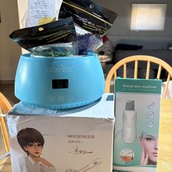 NEW & BARELY USED FACIAL BUNDLE - Wax machine, steamer, and vibrating face shovel