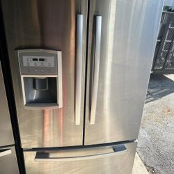 Whirlpool stainless steel refrigerator/ DELIVERY AVAILABLE 