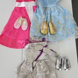 Lot of 18 inch doll clothes sets, fits American Girl dolls, unbranded.
Included three sets of dresses with matching shoes.