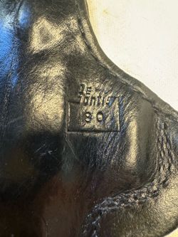 DeSantis thumb break black leather holster for a Beretta 92SB pistol.