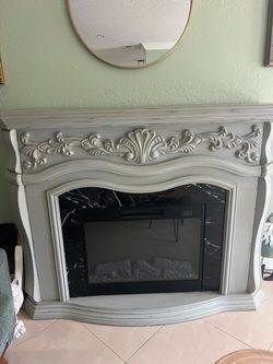 Electric Fireplace with Ornate Wood Mantel