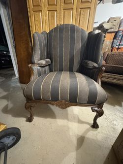 Traditional High-Back Wing Chair with Carved Wood Frame