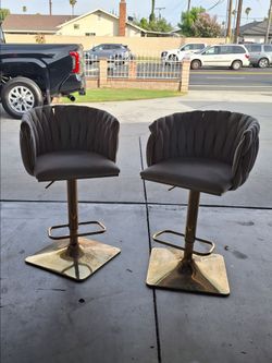 Set of 2 modern adjustable velvet bar stools with a woven braided backrest and a gold pedestal base
