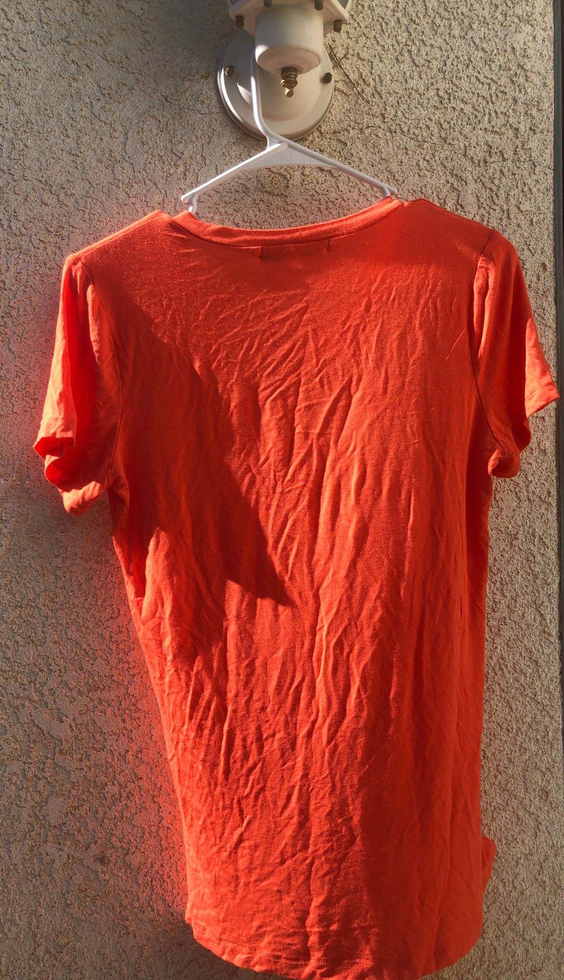 Women’s small orange V-neck top