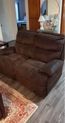 Two brown pull out couches