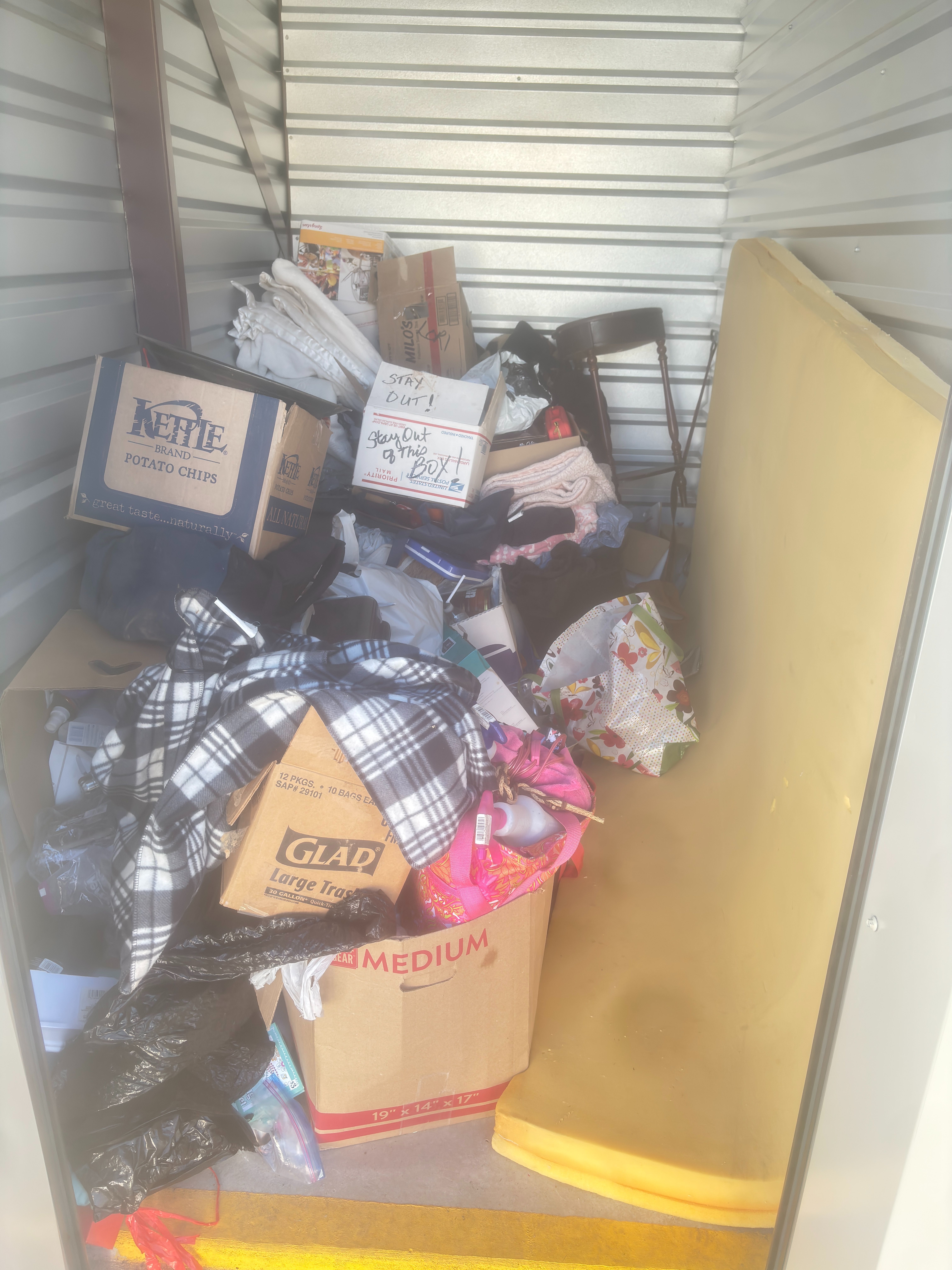 Lien Auction Unit 83 12/9 - CLOTHES HOUSEHOLD GOODS LINENS BOXES OF MYSTERY ITEMS CHAIR FOAM MATTRESS TOPPER,