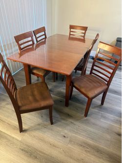 Wood table with plastic cover