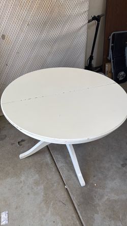 White table with leaf and 4 white chairs