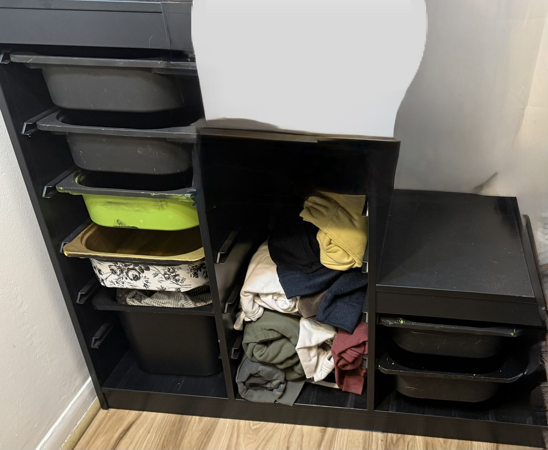 IKEA shelving unit with multiple pull-out bins.