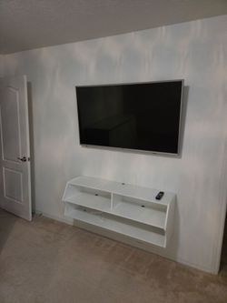 Sharp Flat Screen TV with Wall-Mounted Media Shelf