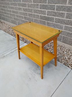vintage mid-century modern two-tier wooden side table featuring a warm honey-brown finish and clean tapered legs
