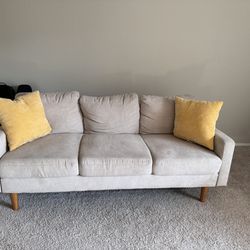 Three Seater Sofa with Yellow Pillows 