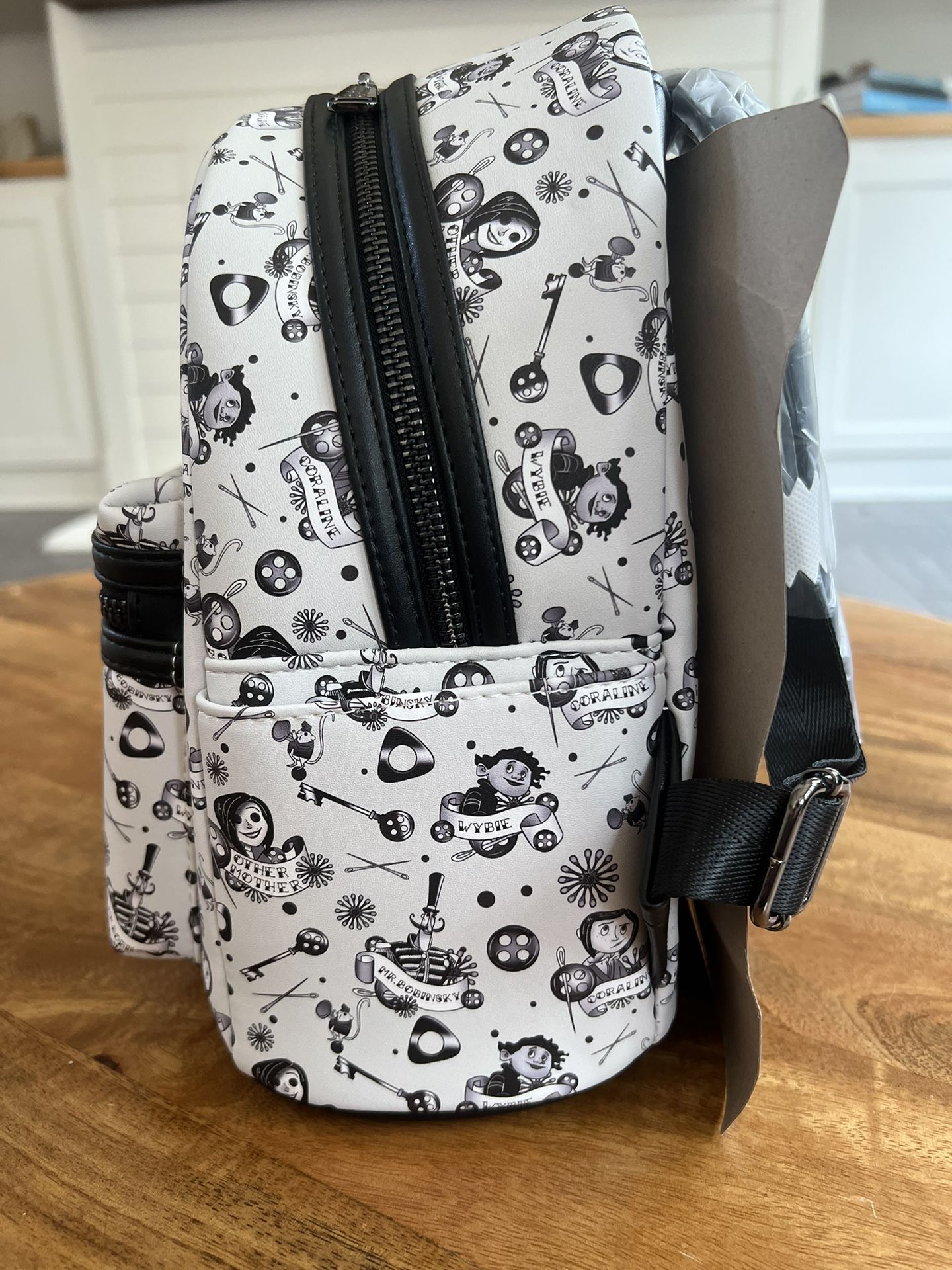 Loungefly LAIKA CORALINE TATTOO AOP MINI BACKPACK for Sale  display picture 1