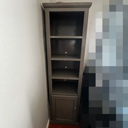 Grey pier with 4 shelves and 2 extra storage spaces