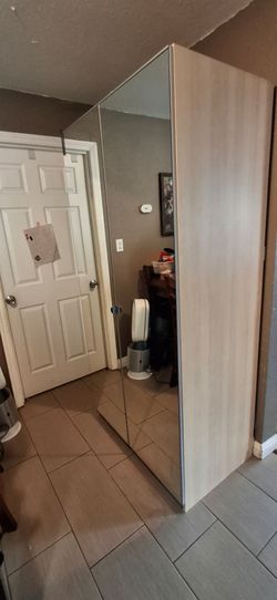 Double door mirror storage closet