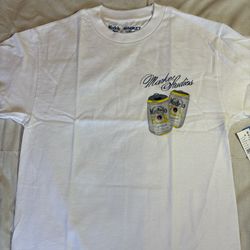 Market Studios x Modelo Especial graphic tee with tags attached.