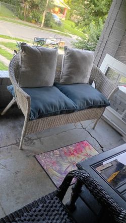 White wicker and pillows