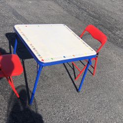 Kids folding table with two chairs good condition