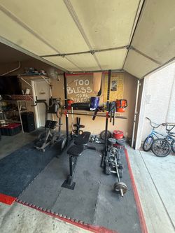 Home Garage Gym Setup with Rack and Weights ab & back rack bike machine .