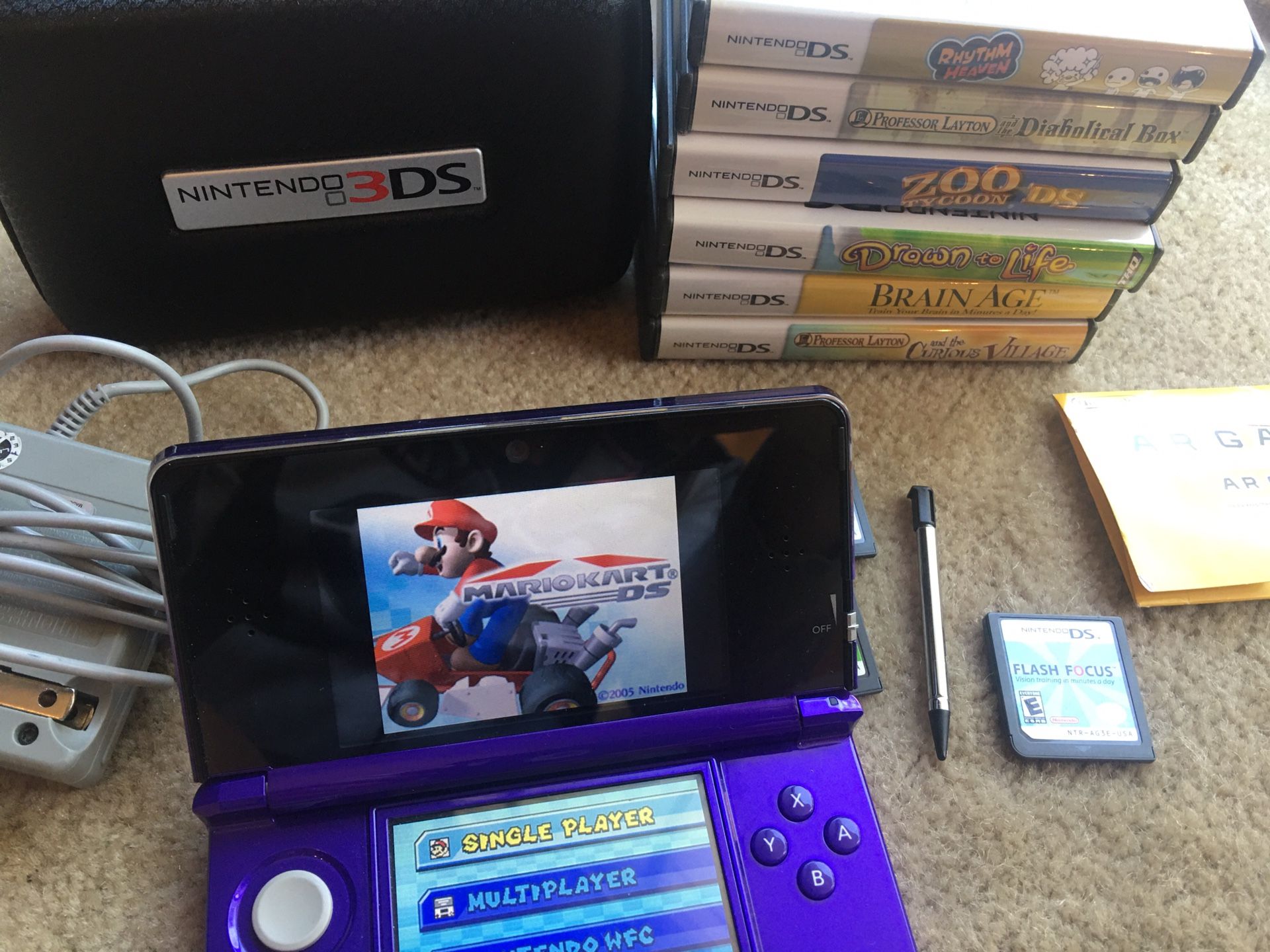 Nintendo 3DS w/ charger, case, Ocarina of Time, Mario Kart, & more!