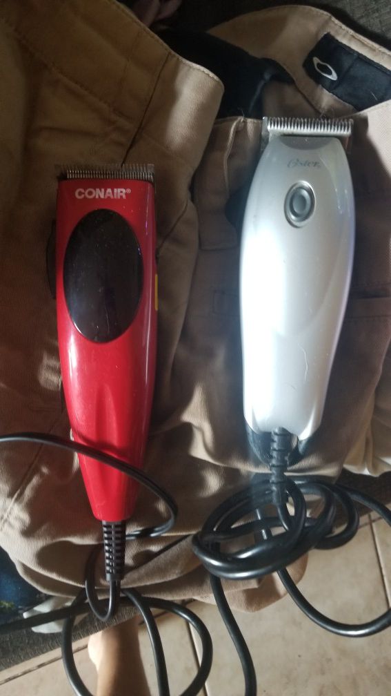 two hair trimmers or clippers. have some attachments