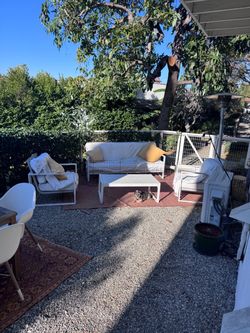 Outdoor couch, two chairs, coffee table