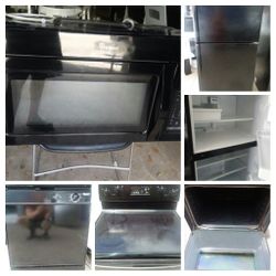 Four piece black kitchen appliance set
