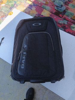Oakley suitcase on wheels