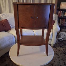 Two tier wood end table wirh doors.