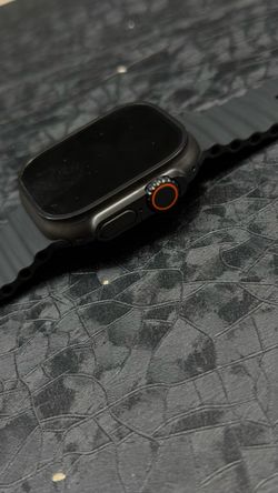 AppleWatch  ultra  3/401 MM IPS + Cellelar unlocked black  titanium w/ CoRD charger.