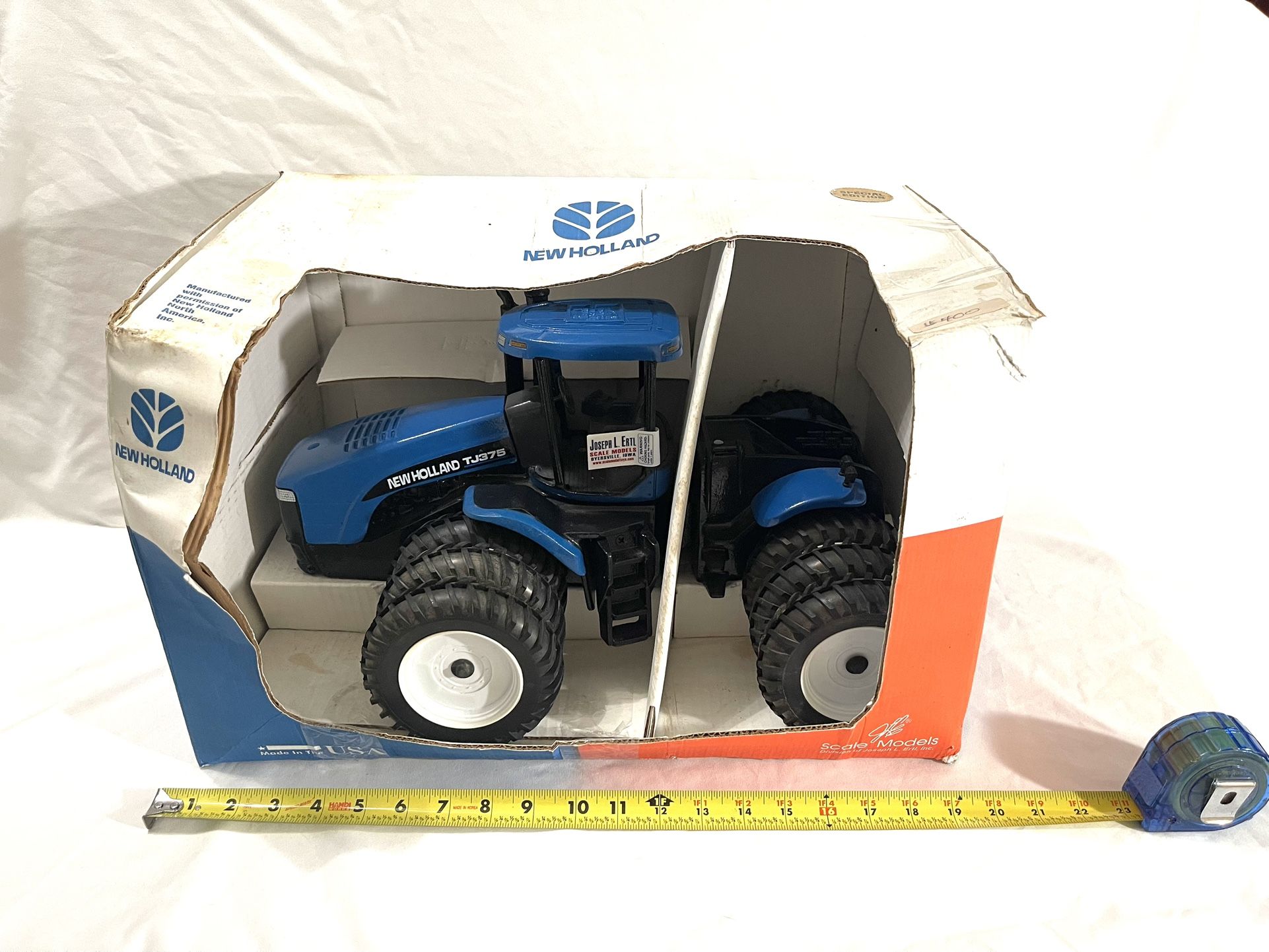 Great Condition Us Made By ERTL Rare Find 1980s Scale 1/8 (New Holland-TJ425) 4 WD Dual Tires For Tractor. Retails for $450.