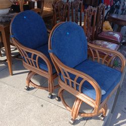 Rattan  Swivel Caster Arm Chairs $80 each