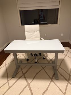 Free- Like new electric sit stand desk with glass top