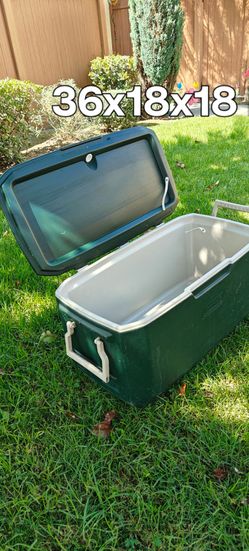 36x18x18 inch. Coleman Xtreme hard-sided cooler with molded drink holders on the lid.