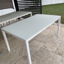 New!!! Modern outdoor aluminum rectangular table with tempered glass, 86”. Never used.