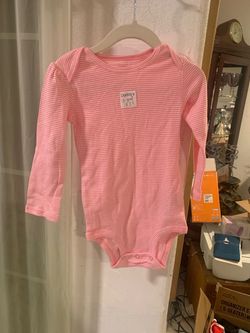 Pink Carter’s baby bodysuit
