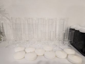 Vases With Flouting Candles 