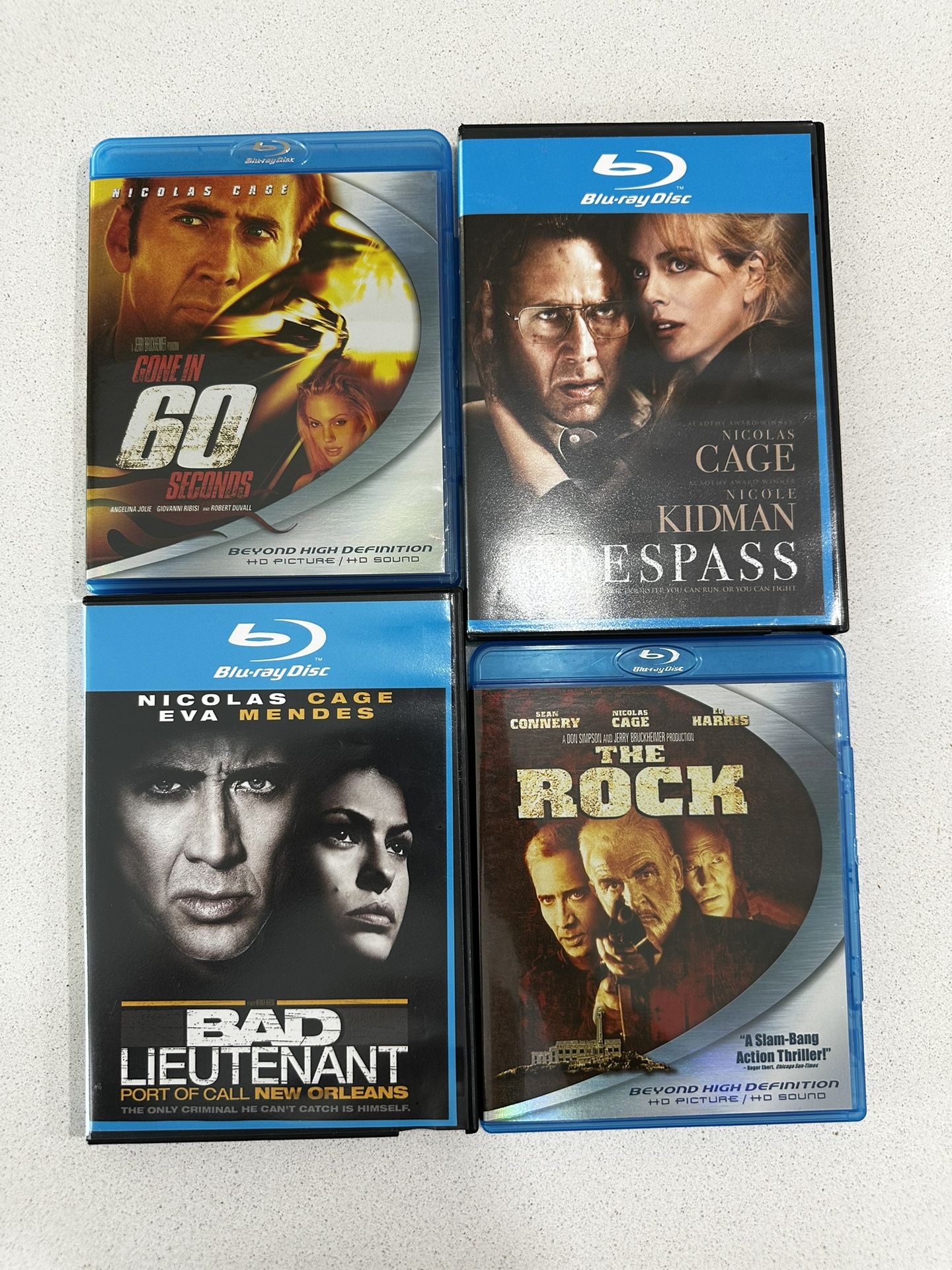 Set Of 4 Blue Ray Action Movies Starring Nicolas Cage. Title Can Be Seen In Pics.