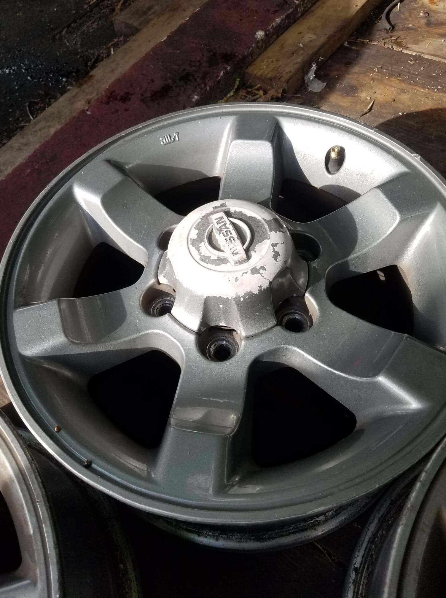 SET OF 4 OEM NISSAN FRONTIER RIMS "15" INCH WHEELS 6 LUG PATTERN. 6 lug
