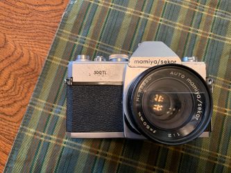Camera...35 mm SLR mamiya/Sekor model 500 TL with 50 mm lens.