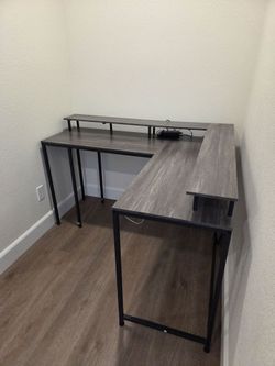Gray 2 tiered wooden computer desk