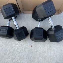 new  pair of 50lb and 55lb rubber dumbbells  $210