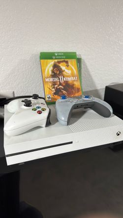 Xbox One S with two controllers and three games