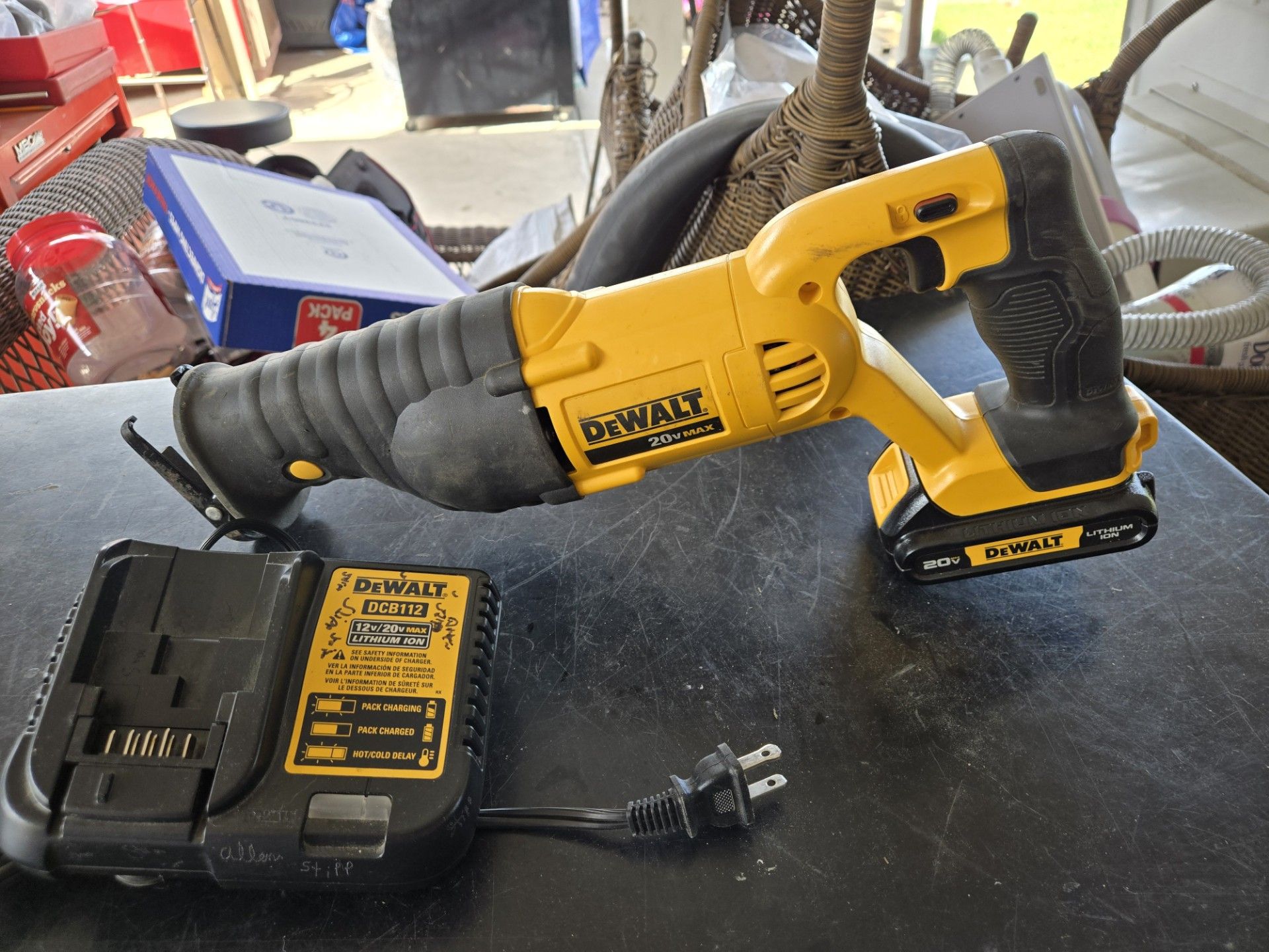 20 volts DEWALT ZAWSAW one battery and a charger.