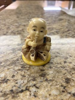Baby monk smoking pipe figurine (3”)