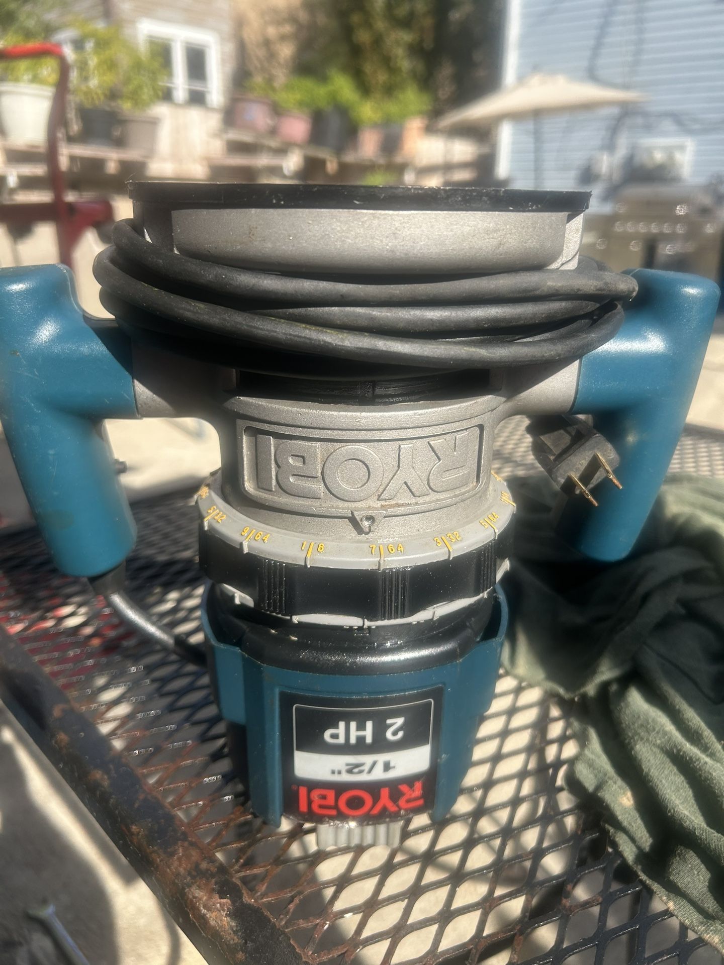 This is a Ryobi 2 HP Plunge Base Router. It has a 10-amp variable-speed motor