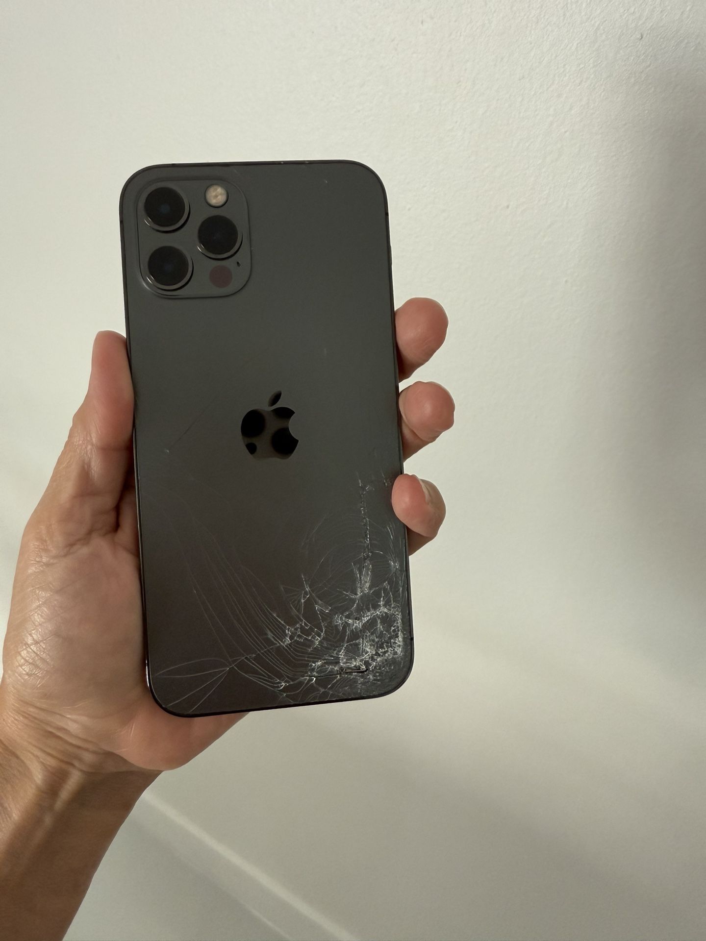 Apple iPhone 12 Pro, Work Perfect, Cracked Back Glass, Unlocked For Any Carrier, Comes With Charger And Clear Case