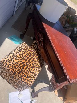 Slim table and two side stools with custom leopard covers
