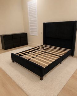 Black queen platform bed and nine drawer dresser
